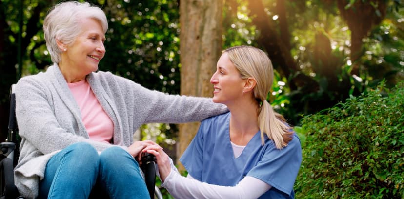 A caregiver and resident outdoors at Williamsport Health and Rehabilitation